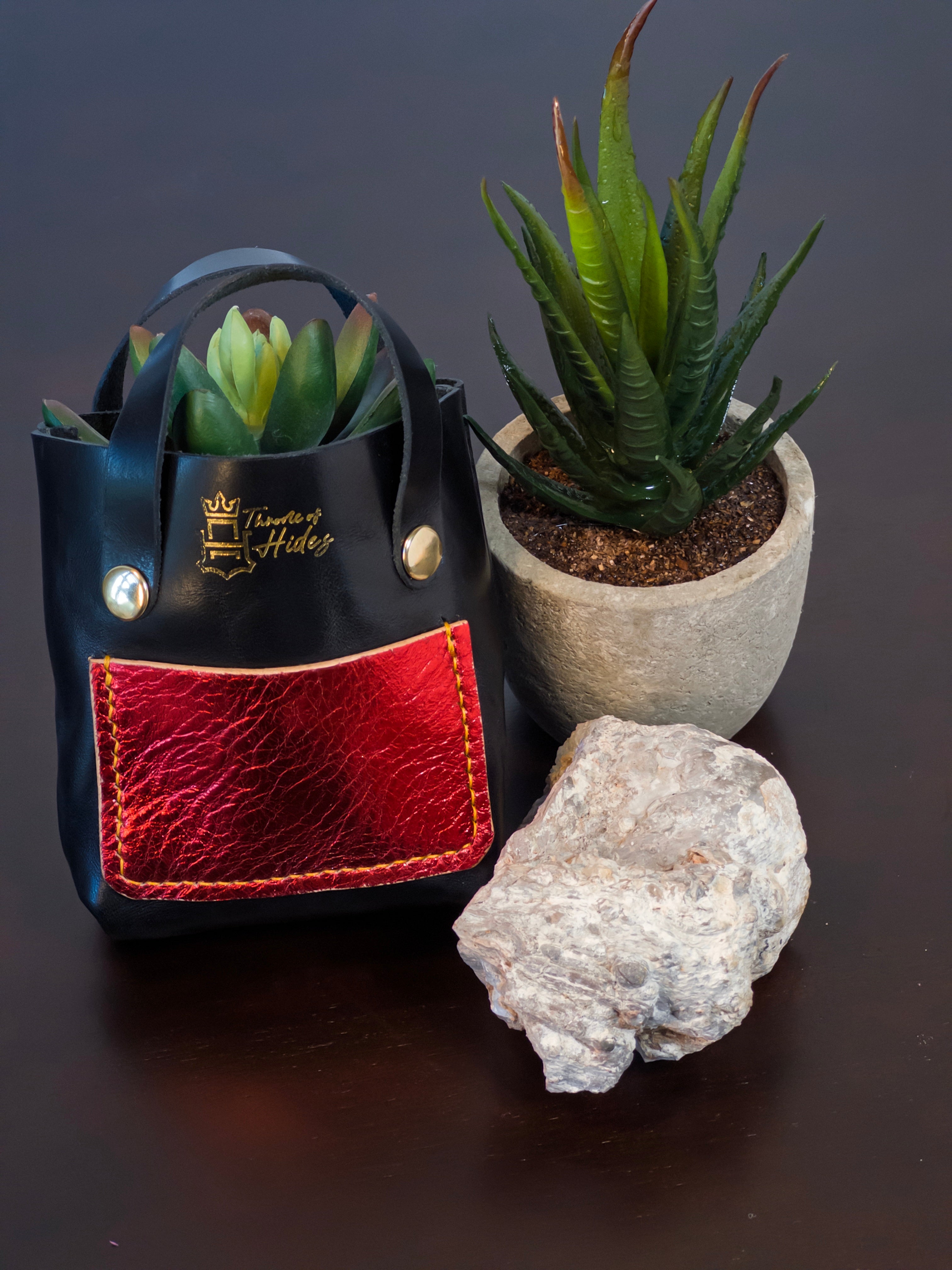 Handcrafted palm-sized leather mini tote bag made from premium vegetable tanned leather, perfect as a unique decorative accessory, luxury gift packaging, or artisan-made display piece for small items, jewelry, and trinkets