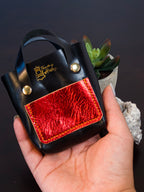 Handcrafted palm-sized leather mini tote bag made from premium vegetable tanned leather, perfect as a unique decorative accessory, luxury gift packaging, or artisan-made display piece for small items, jewelry, and trinkets