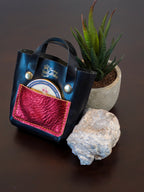 Handcrafted palm-sized leather mini tote bag made from premium vegetable tanned leather, perfect as a unique decorative accessory, luxury gift packaging, or artisan-made display piece for small items, jewelry, and trinkets