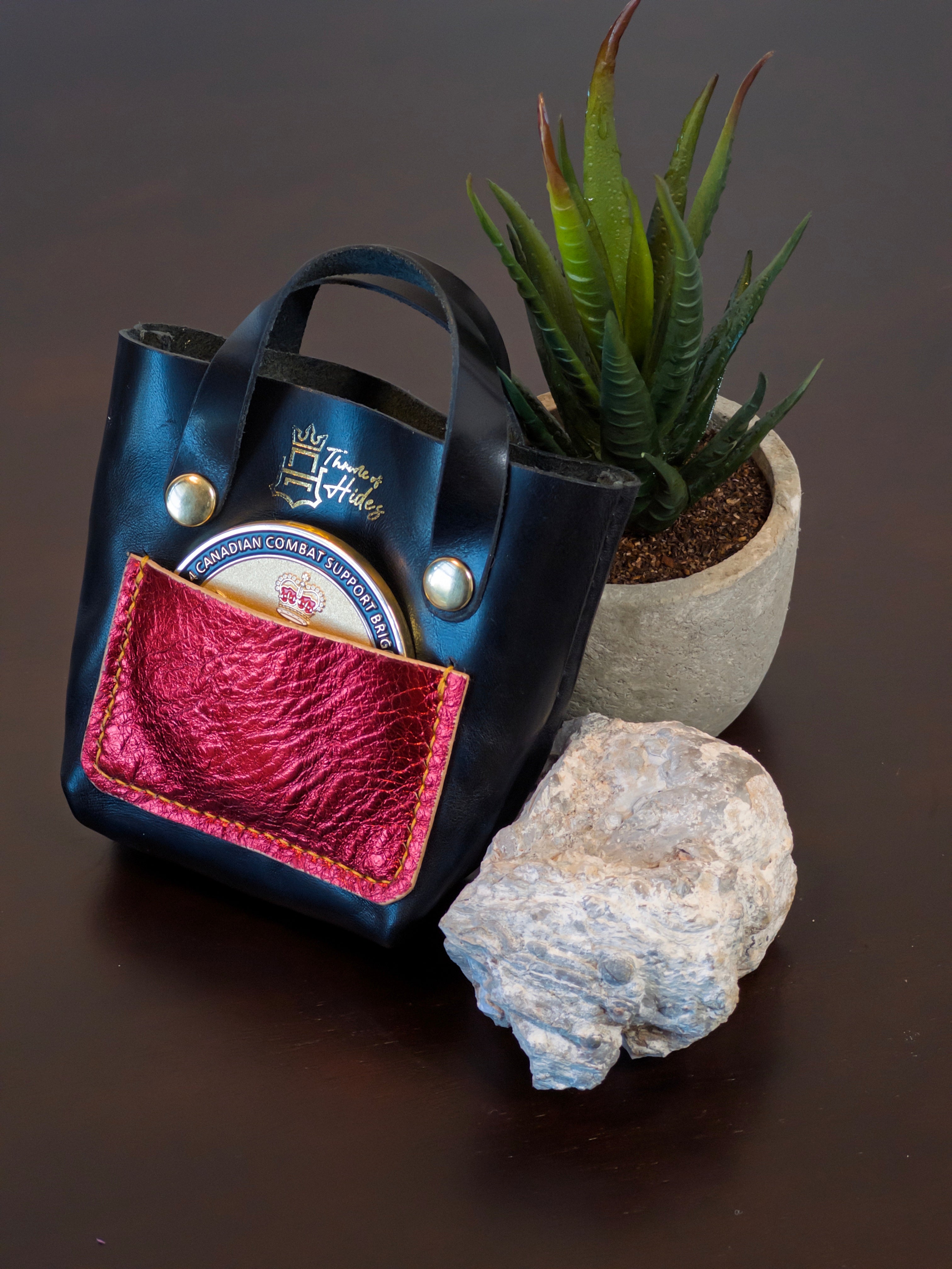 Handcrafted palm-sized leather mini tote bag made from premium vegetable tanned leather, perfect as a unique decorative accessory, luxury gift packaging, or artisan-made display piece for small items, jewelry, and trinkets